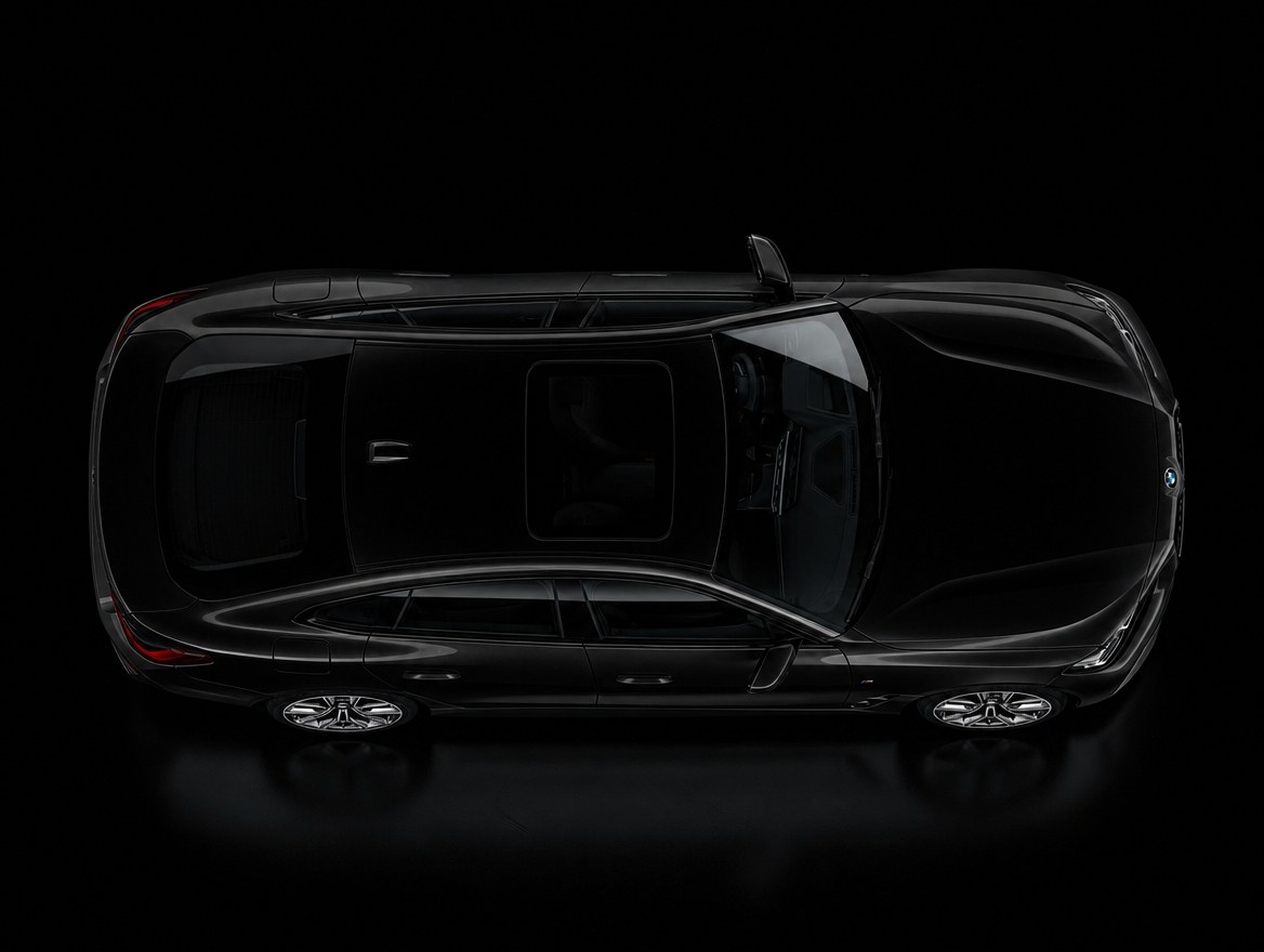 A black BMW i4 seen from directly above in low light: the full roofline, windscreen and rear glass of the car the calibration is performed on